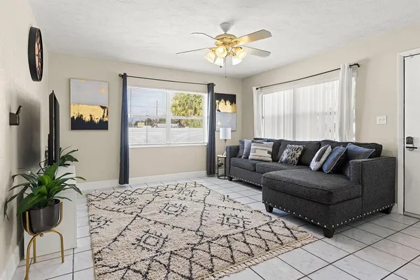 a living room with furniture and a large window