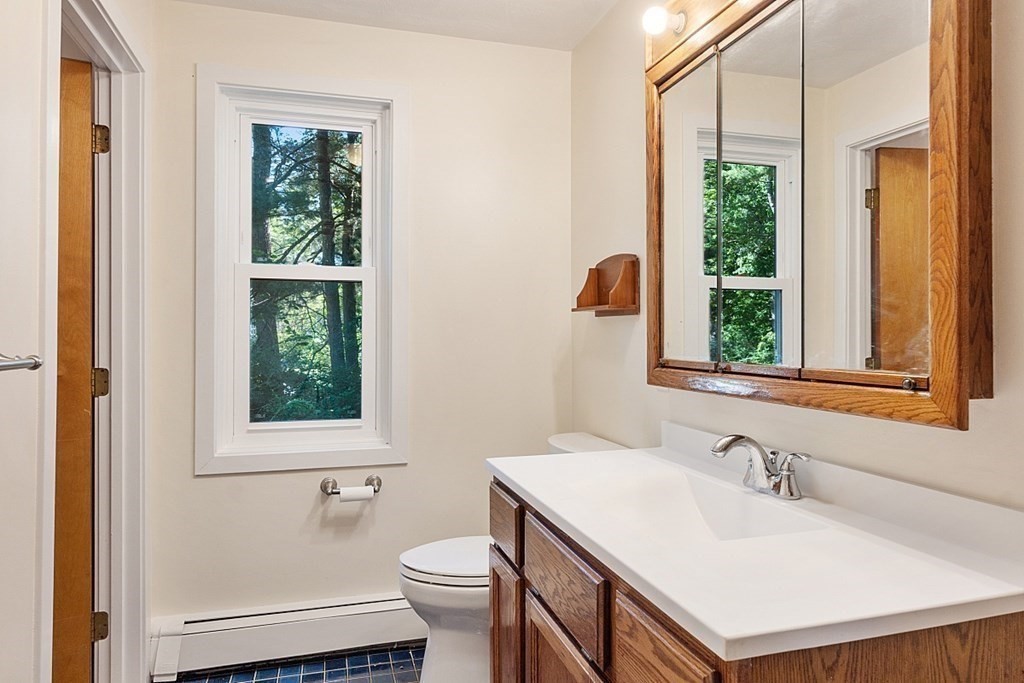 71 Mill Road Littleton, MA 01460 - Photo 12 of 30 a bathroom with a sink and a toilet