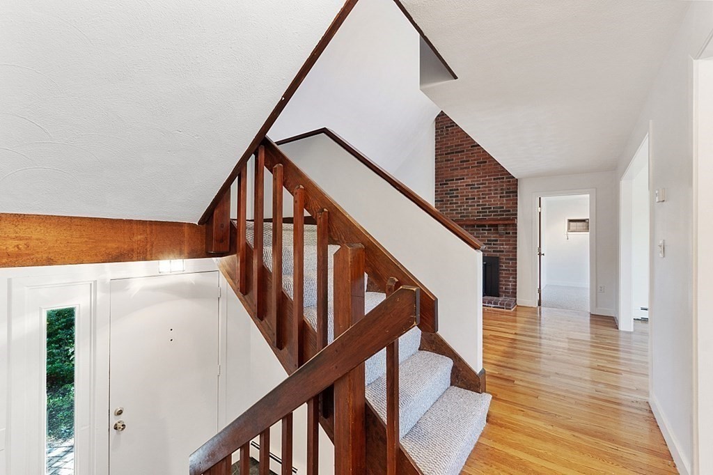71 Mill Road Littleton, MA 01460 - Photo 14 of 30 a view of staircase with wooden floor and white walls