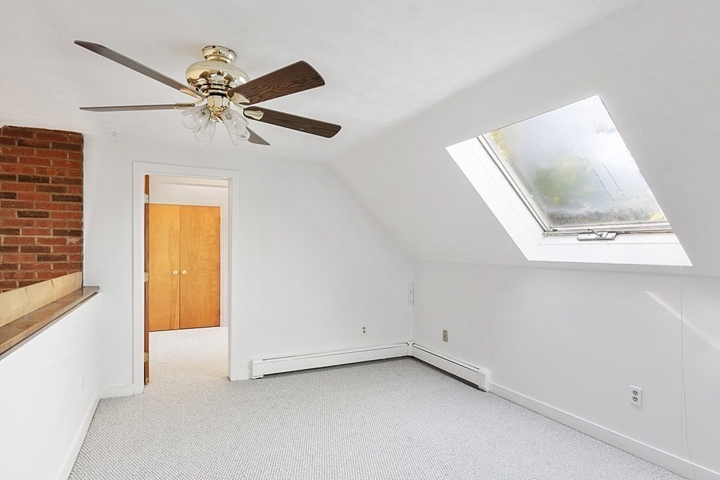 71 Mill Road Littleton, MA 01460 - Photo 18 of 30 a view of an empty room with a window