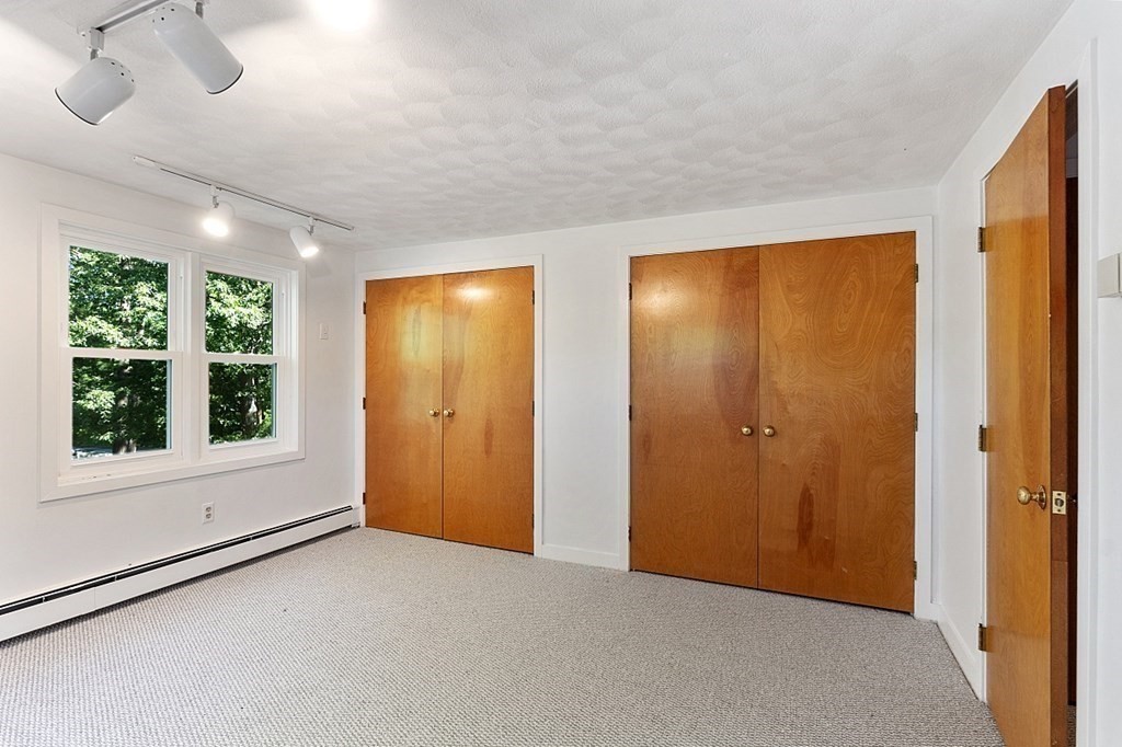 71 Mill Road Littleton, MA 01460 - Photo 19 of 30 a view of an empty room with a window