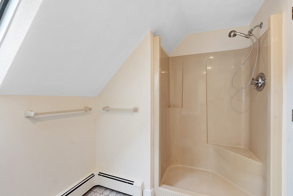 71 Mill Road Littleton, MA 01460 - Photo 21 of 30 a bathroom with a shower and a glass door