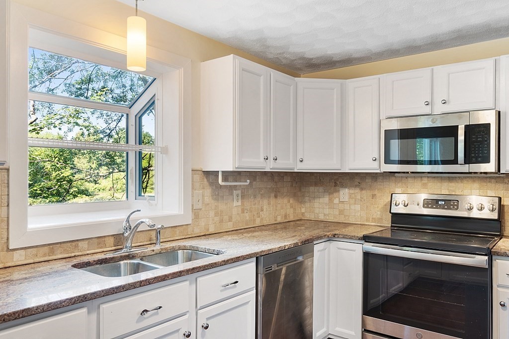 71 Mill Road Littleton, MA 01460 - Photo 4 of 30 a kitchen with appliances a sink and a window