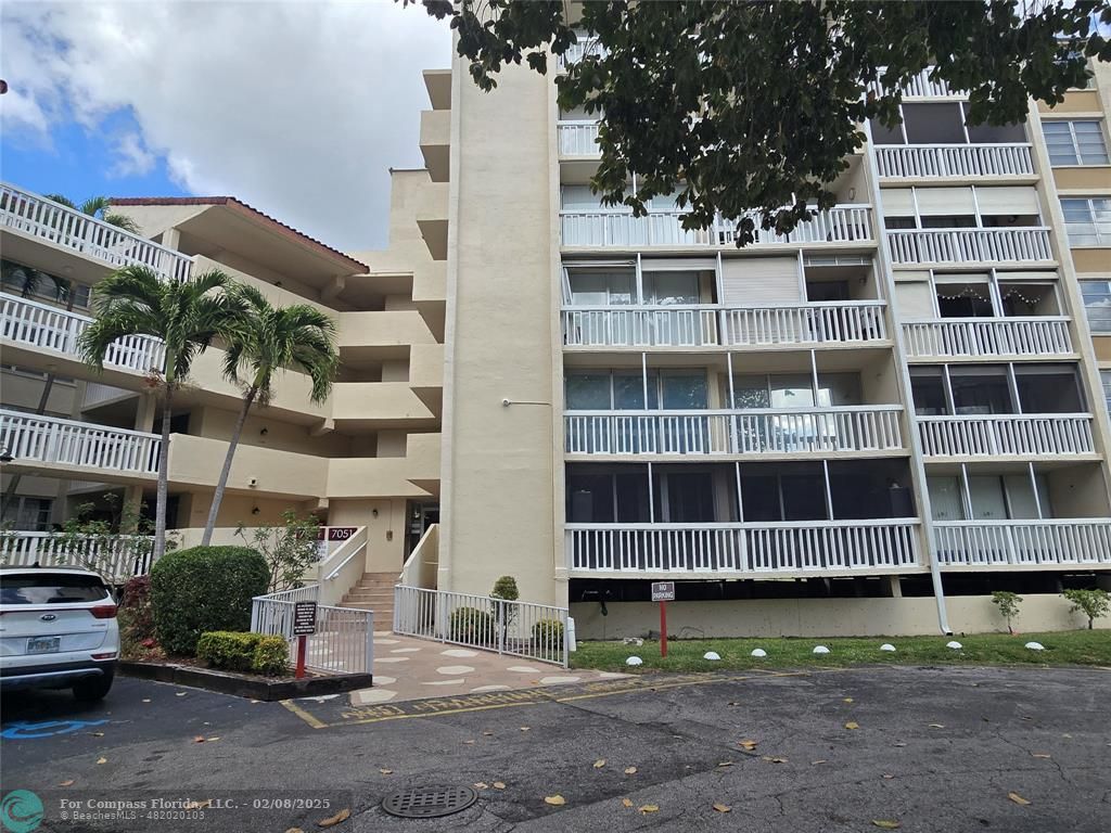 a view of tall building with a street