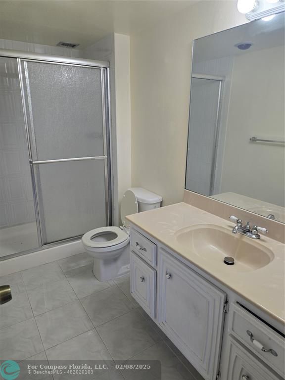 7051 Environ Boulevard, Unit 336 Lauderhill, FL 33319 - Photo 12 of 15 a bathroom with a sink toilet and shower