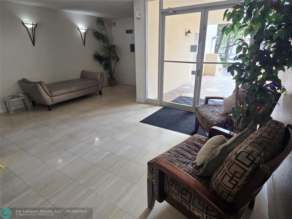 7051 Environ Boulevard, Unit 336 Lauderhill, FL 33319 - Photo 2 of 15 a living room with furniture