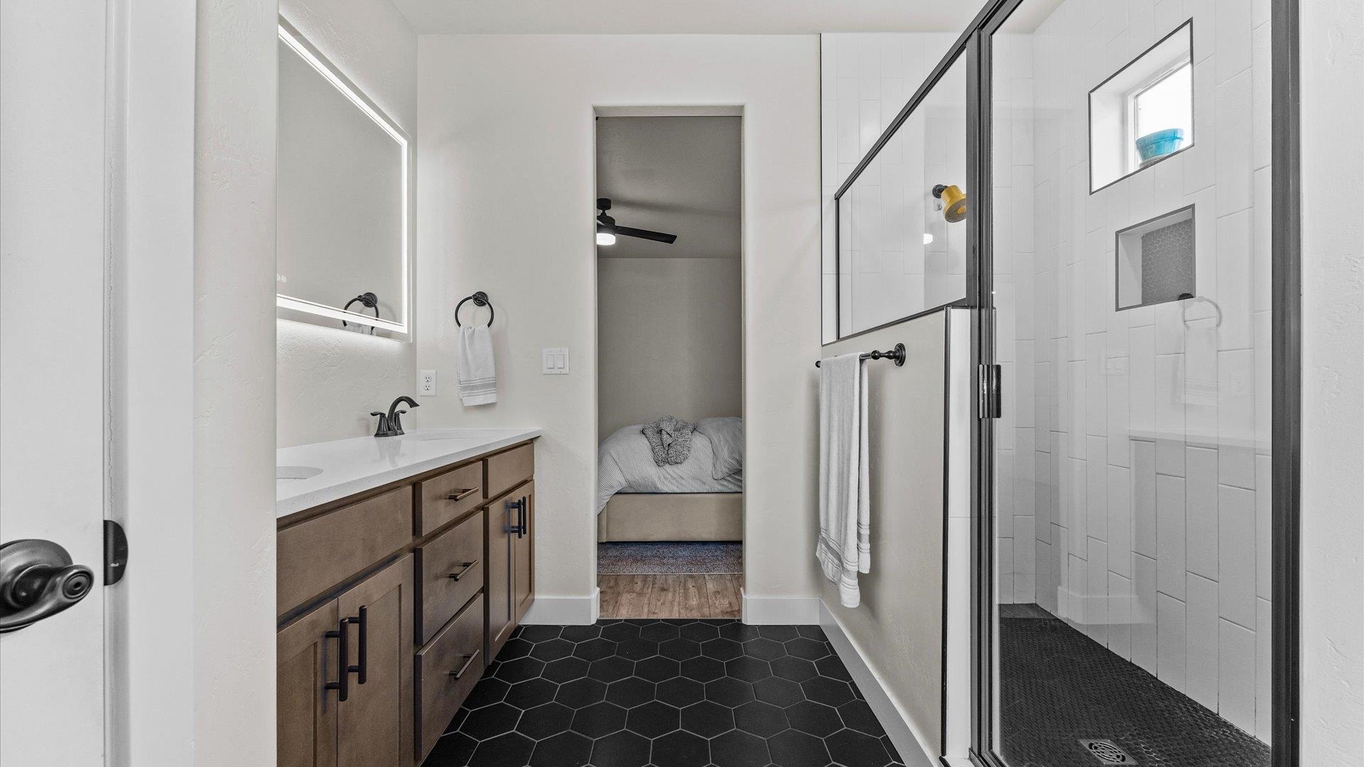 840 Rupp Avenue Palisade, CO 81526 - Photo 18 of 27 a bathroom with a sink a toilet and shower