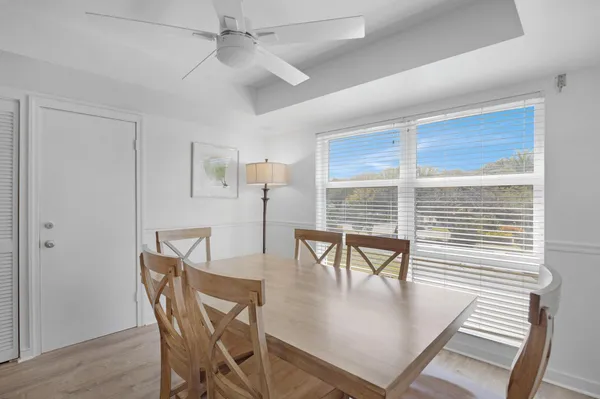 a bedroom with two beds and a large window with outer view
