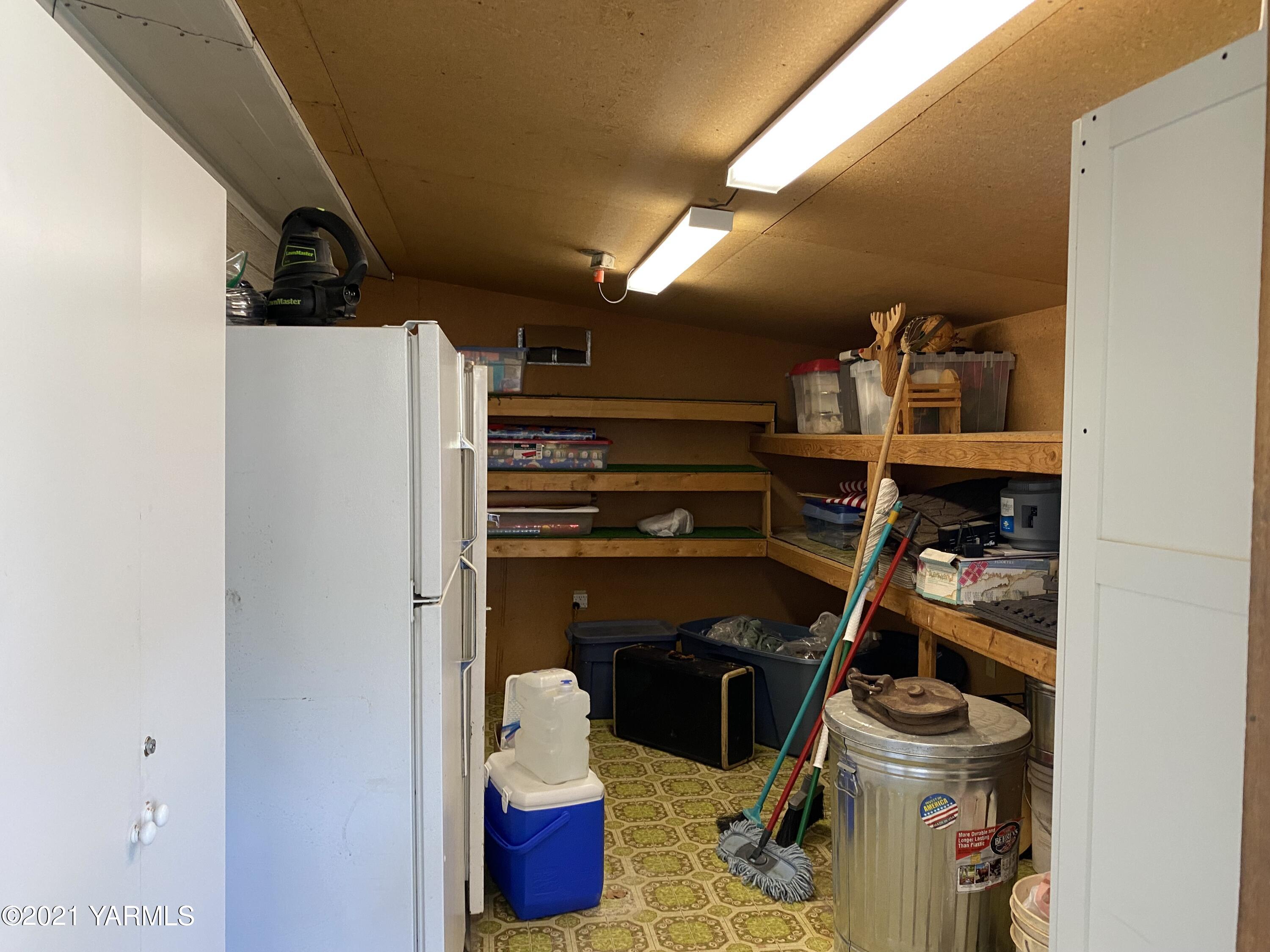 363 Riggins Road Wapato, WA 98951 - Photo 11 of 14 a view of walk in closet with clothes and shoes