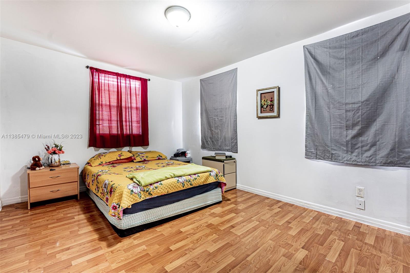 8241 Southwest 37th Street Miami, FL 33155 - Photo 20 of 46 a bedroom with a bed and window