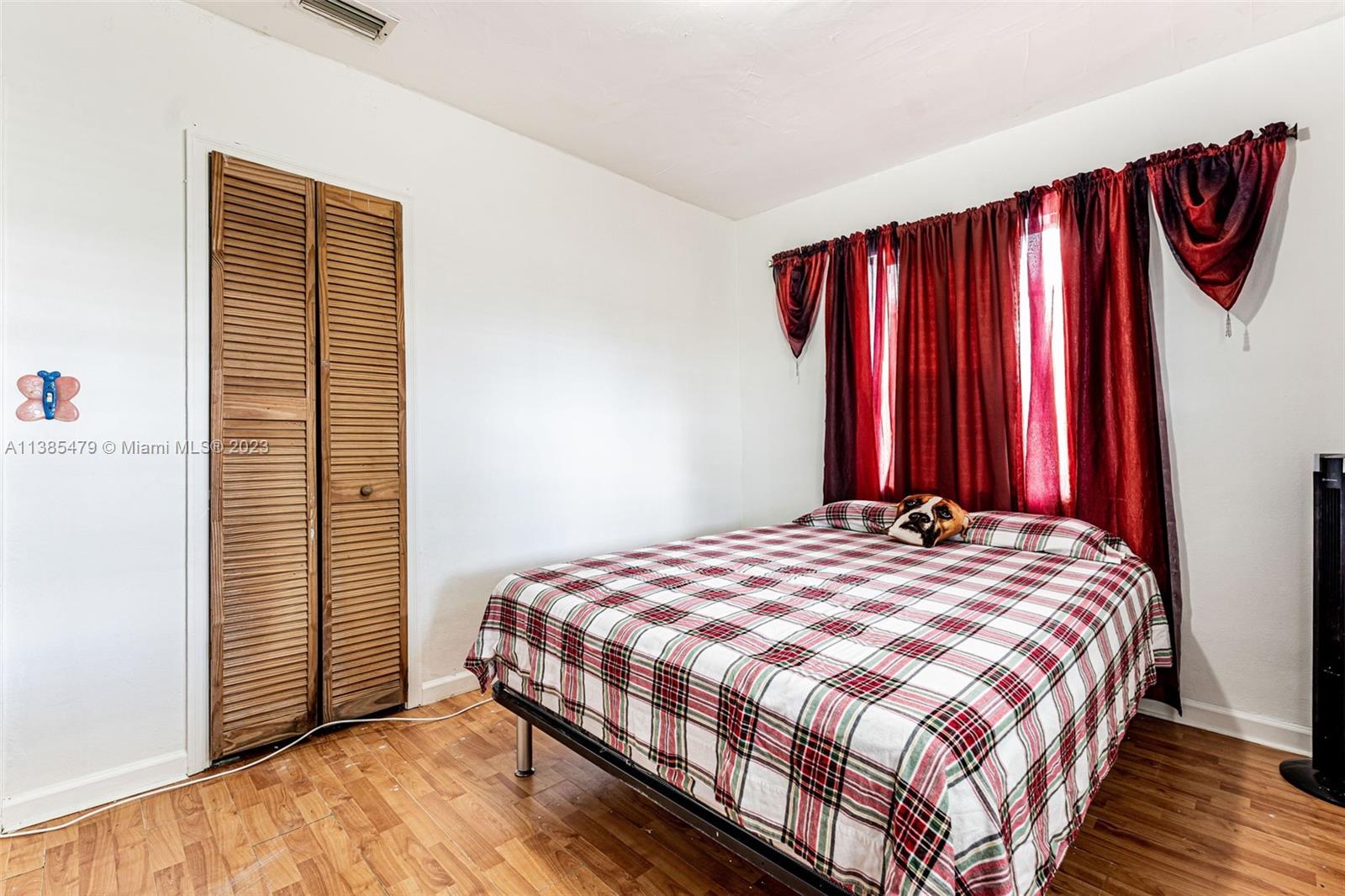 8241 Southwest 37th Street Miami, FL 33155 - Photo 23 of 46 a bedroom with a bed and a closet