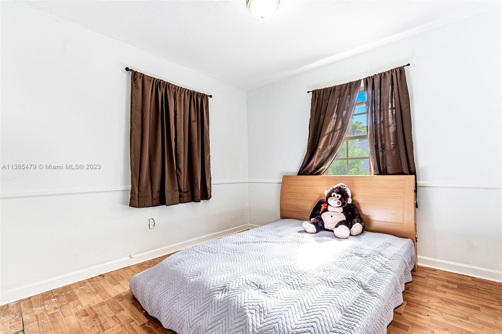 8241 Southwest 37th Street Miami, FL 33155 - Photo 24 of 46 a bedroom with a bed and a window