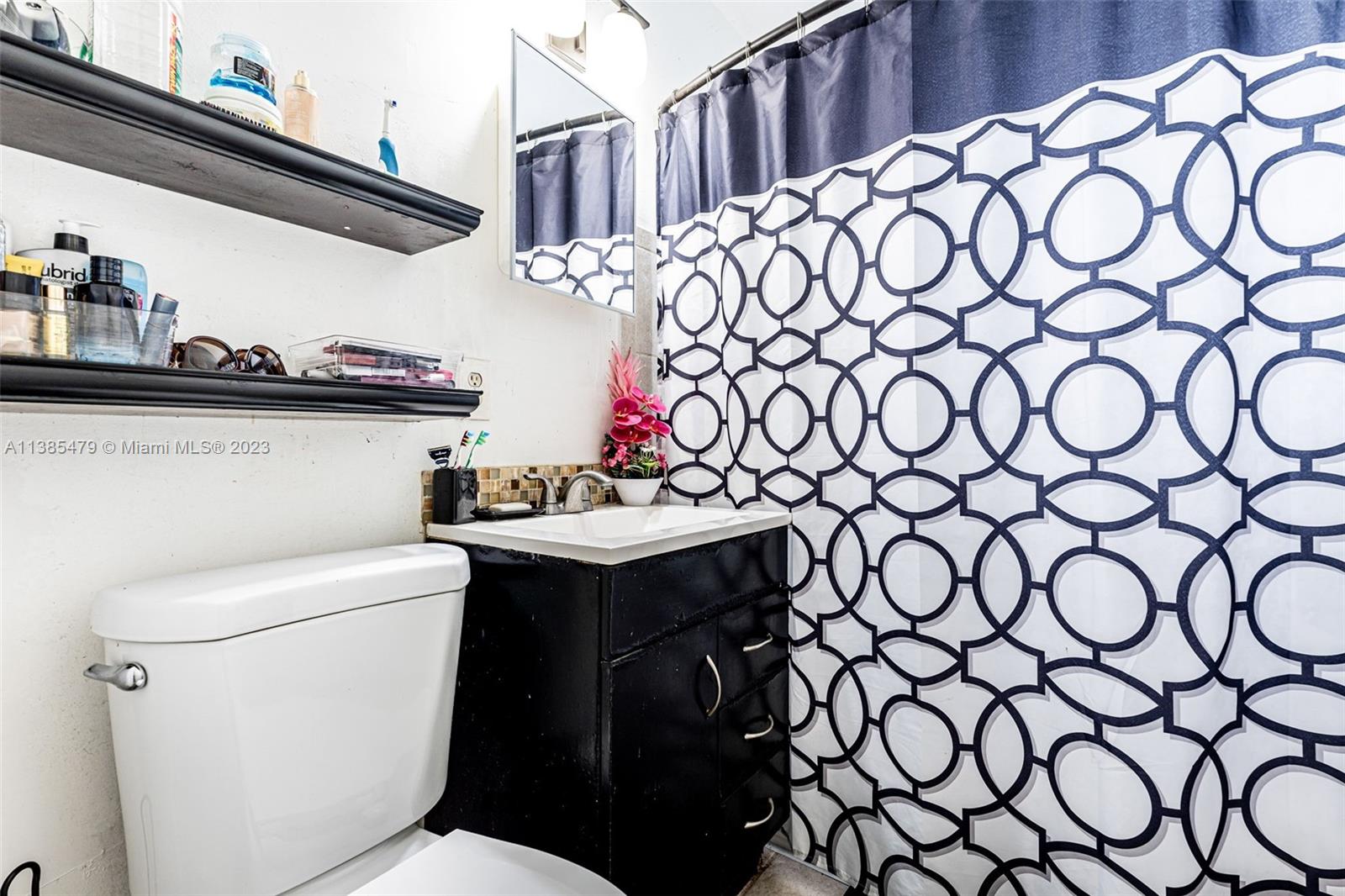 8241 Southwest 37th Street Miami, FL 33155 - Photo 26 of 46 a bathroom with a sink and a toilet