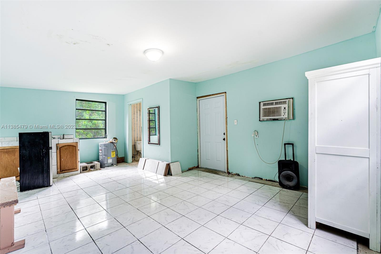 8241 Southwest 37th Street Miami, FL 33155 - Photo 27 of 46 a bedroom with a bed and a large window