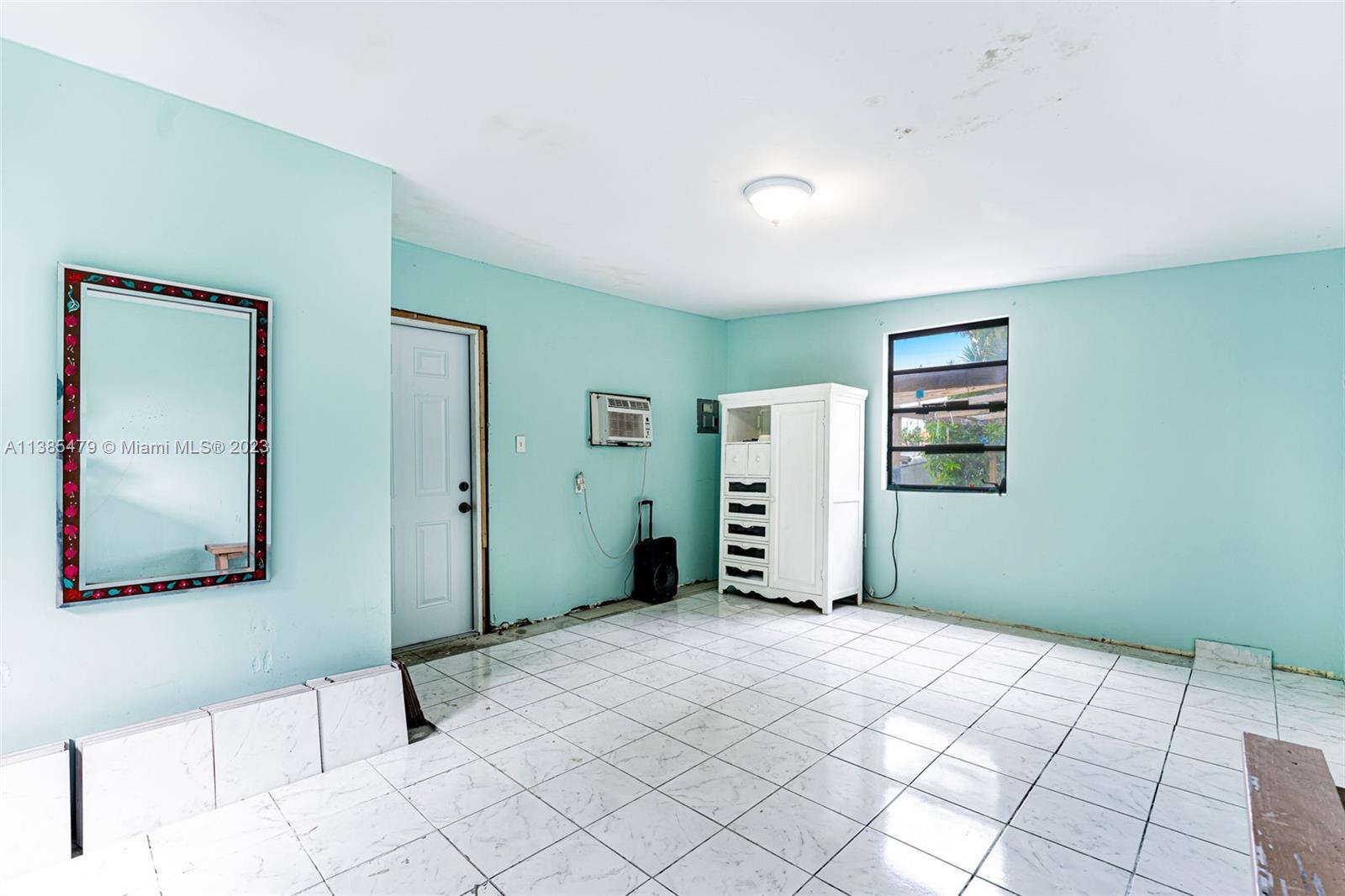 8241 Southwest 37th Street Miami, FL 33155 - Photo 28 of 46 a bedroom with a bed and a painting on the wall