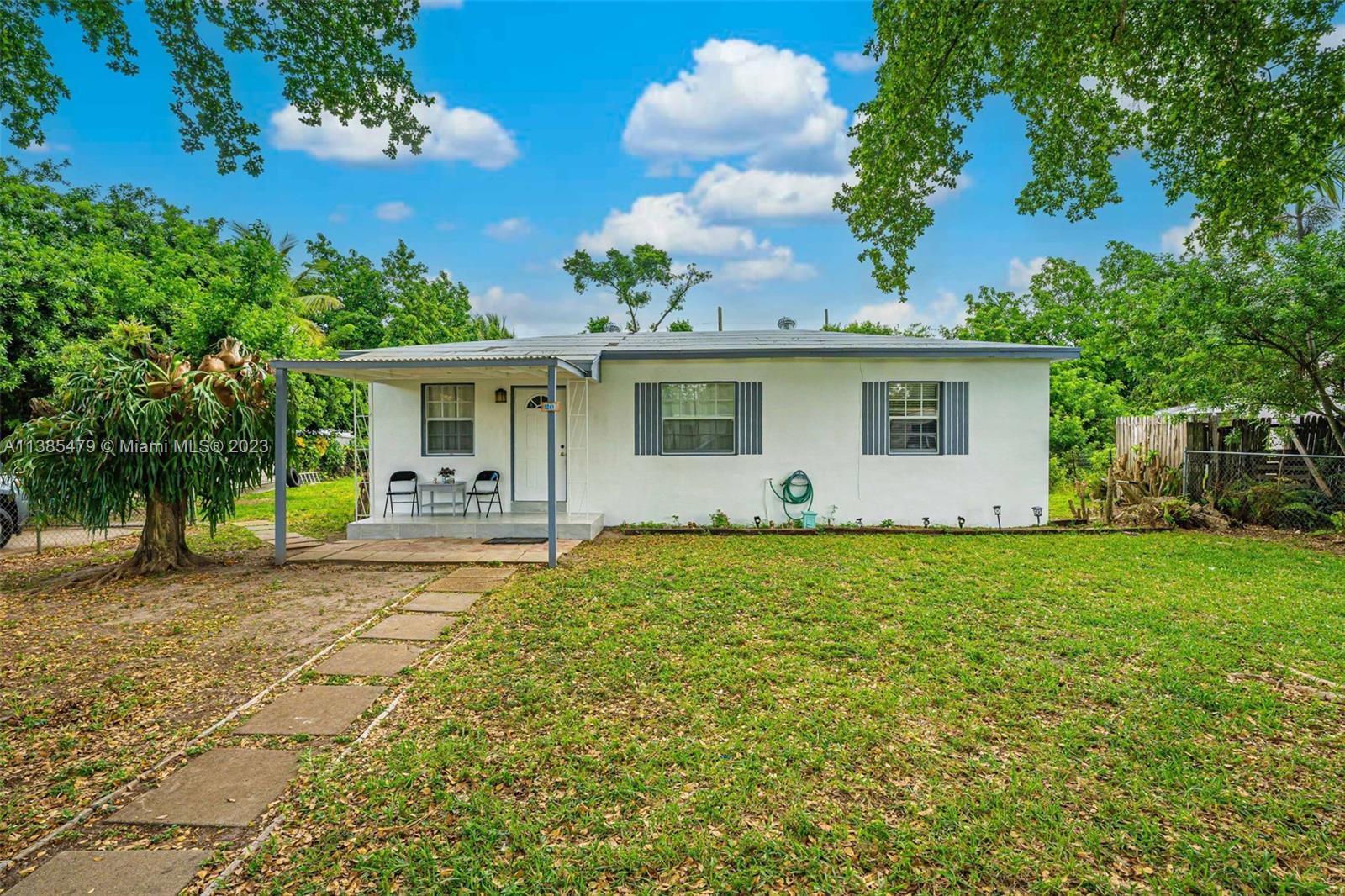 8241 Southwest 37th Street Miami, FL 33155 - Photo 3 of 46 a view of a house with backyard and garden