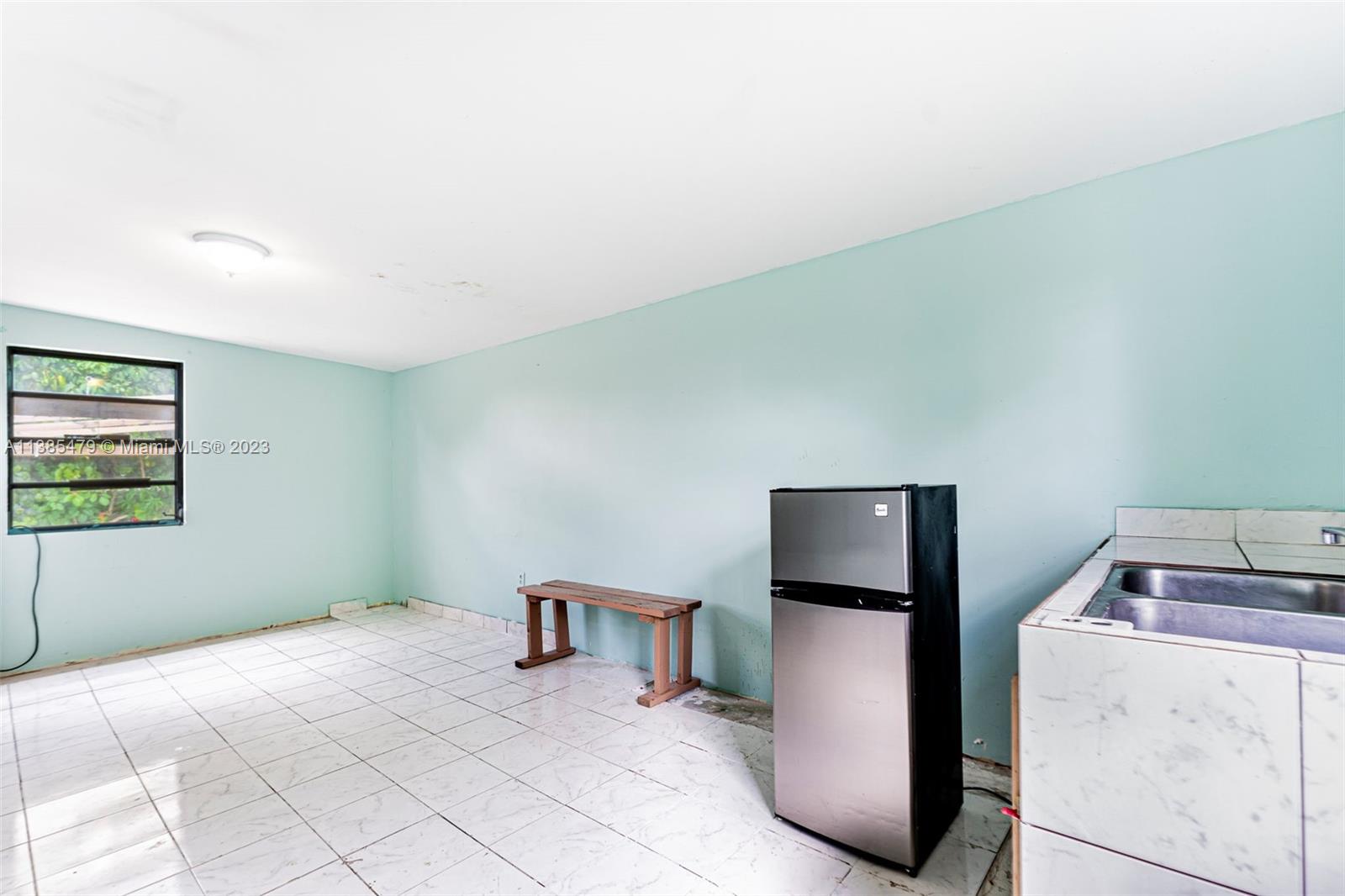 8241 Southwest 37th Street Miami, FL 33155 - Photo 31 of 46 a room with storage and utility