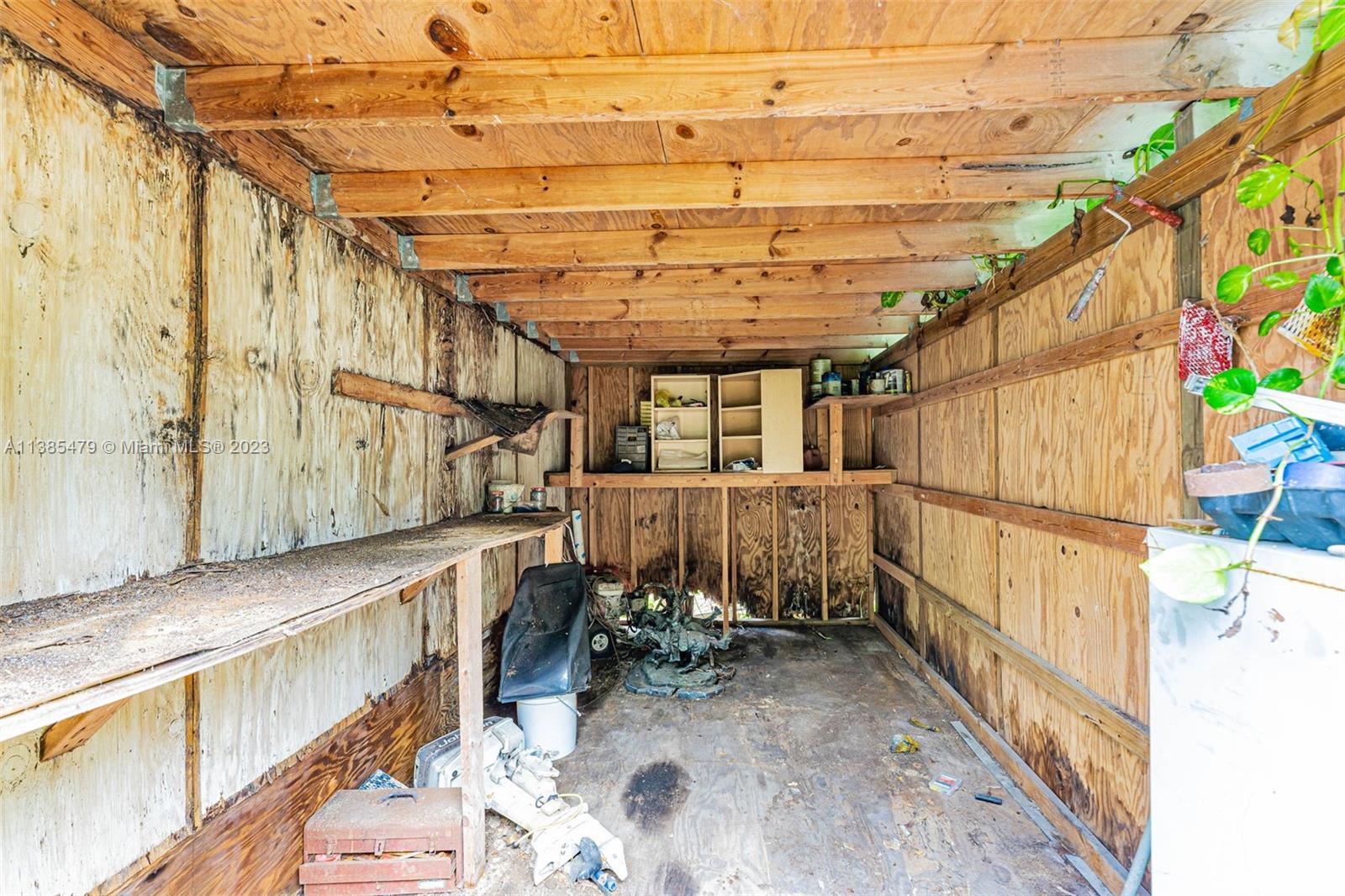 8241 Southwest 37th Street Miami, FL 33155 - Photo 34 of 46 a view of a storage room with wooden walls