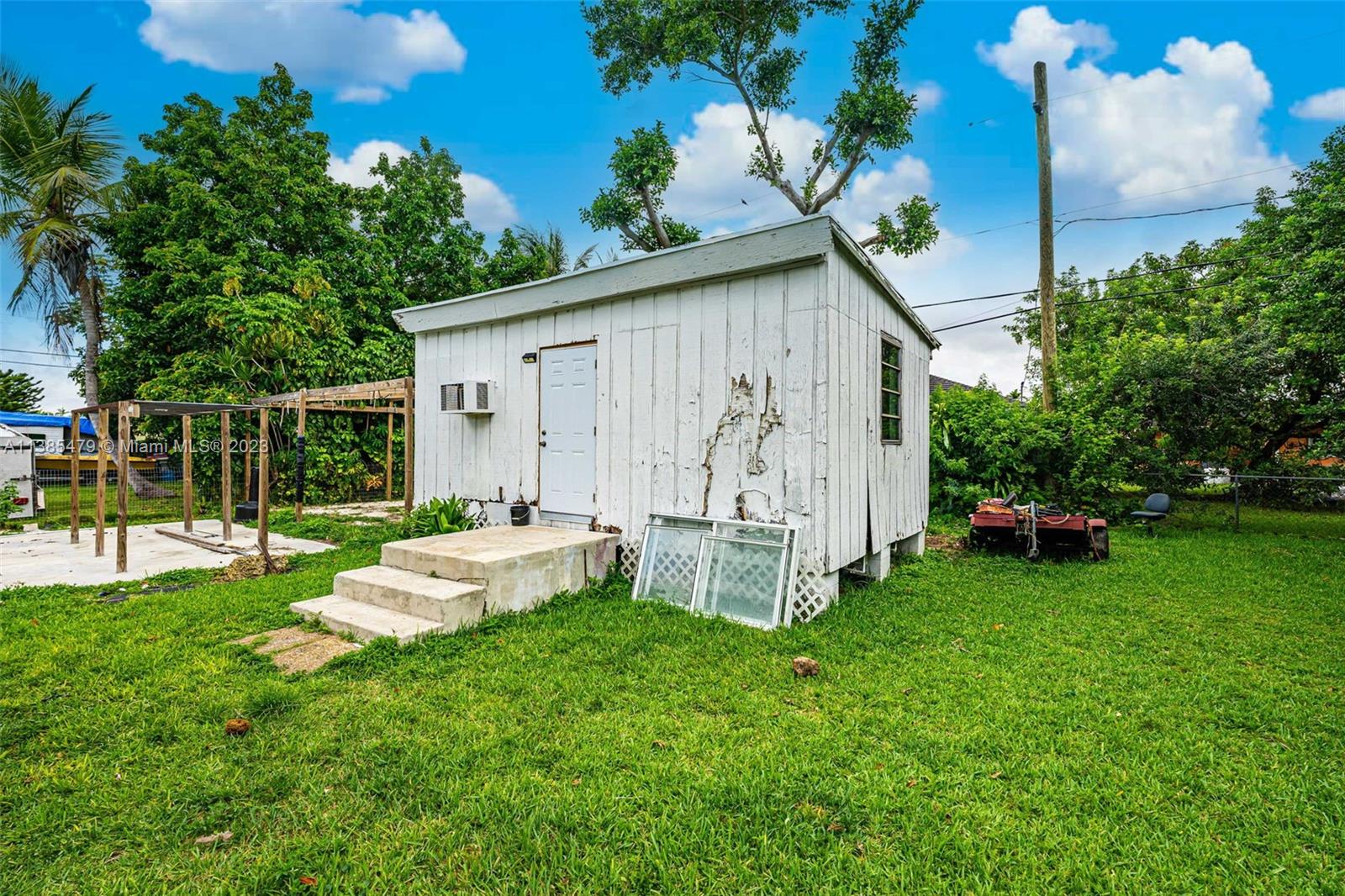 8241 Southwest 37th Street Miami, FL 33155 - Photo 35 of 46 a view of a house with backyard sitting area and garden