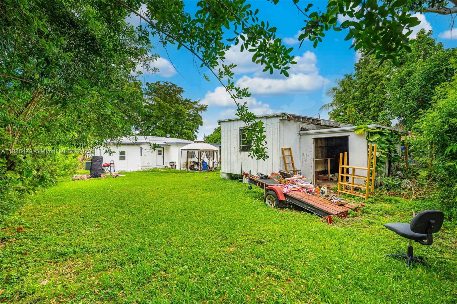 8241 Southwest 37th Street Miami, FL 33155 - Photo 37 of 46 a view of a house with backyard sitting area and garden