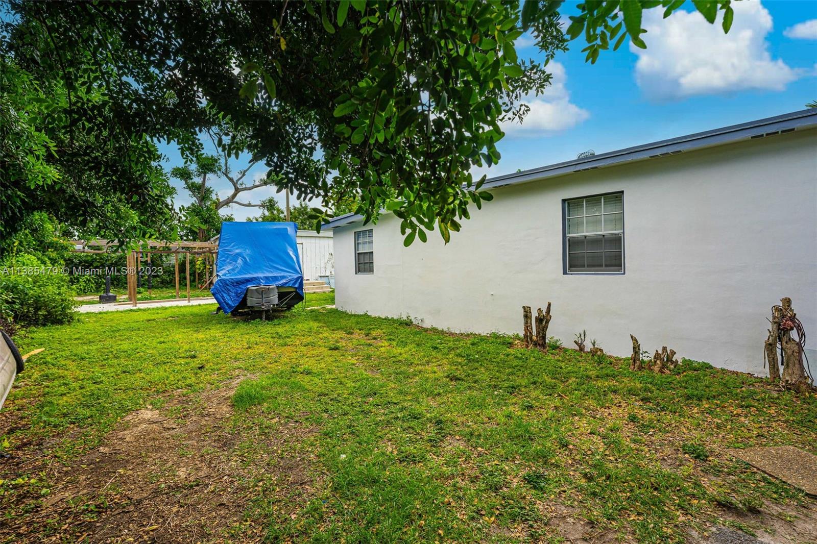 8241 Southwest 37th Street Miami, FL 33155 - Photo 40 of 46 a house is sitting in middle od the grass