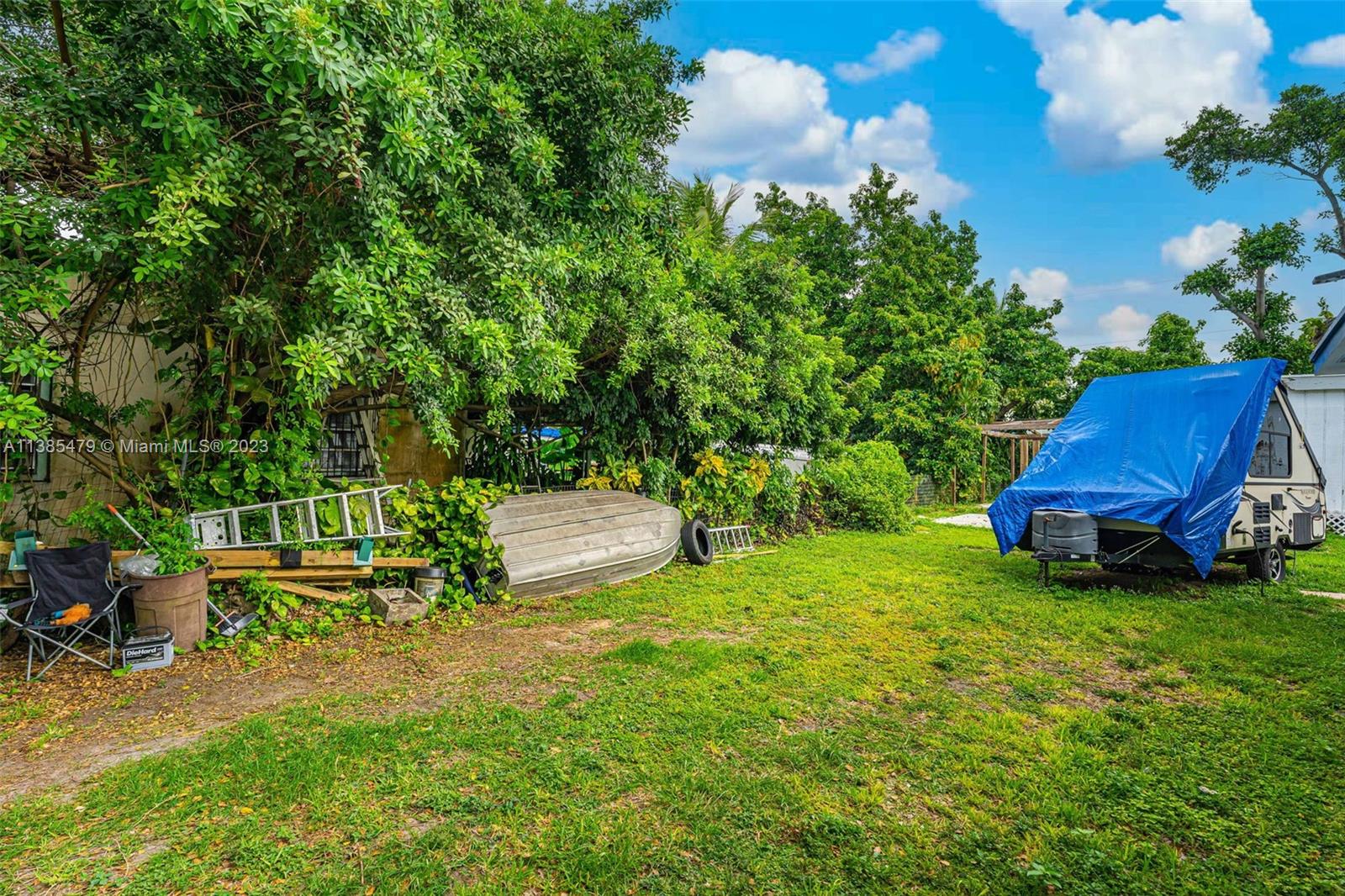 8241 Southwest 37th Street Miami, FL 33155 - Photo 41 of 46 a view of a chair and table on the garden