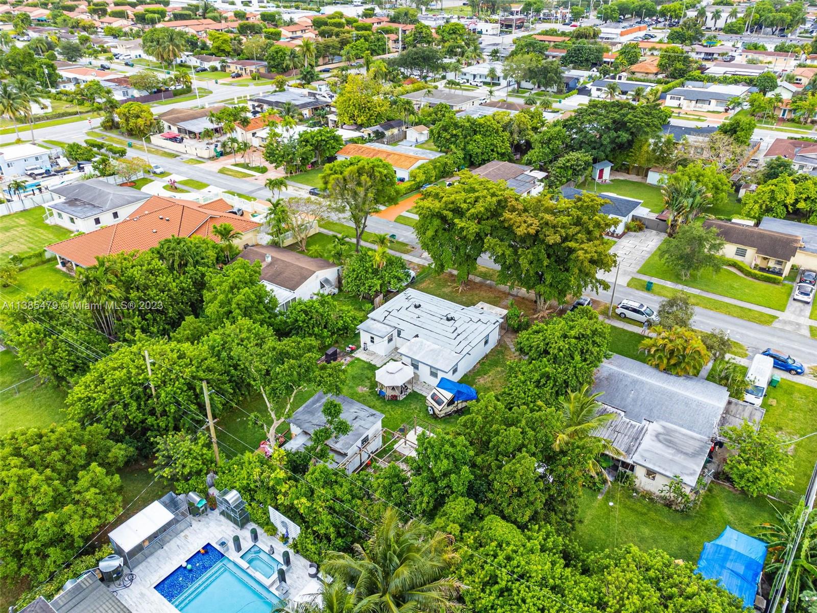 8241 Southwest 37th Street Miami, FL 33155 - Photo 42 of 46 an aerial view of residential houses with outdoor space and trees all around