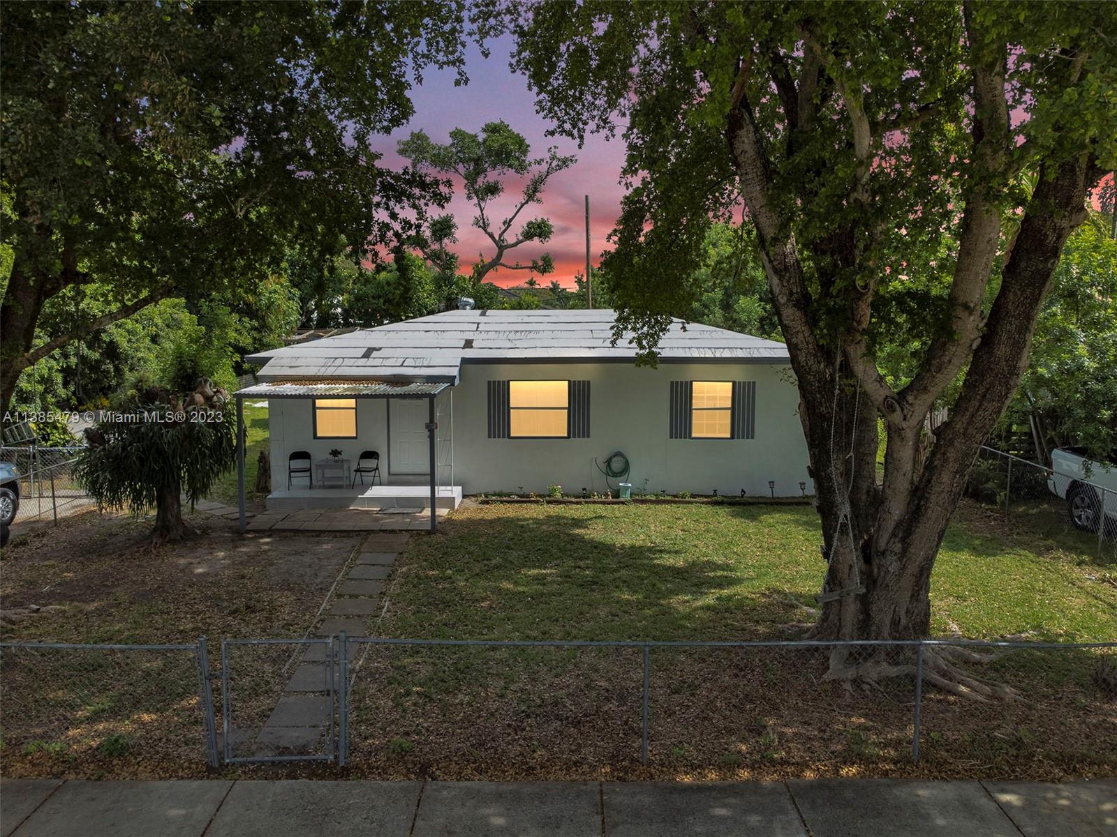 8241 Southwest 37th Street Miami, FL 33155 - Photo 46 of 46 a backyard of a house with seating space