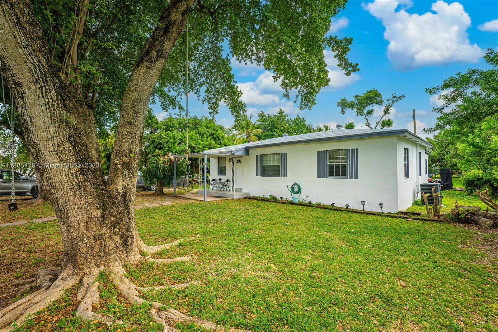 8241 Southwest 37th Street Miami, FL 33155 - Photo 5 of 46 a view of a house with a backyard