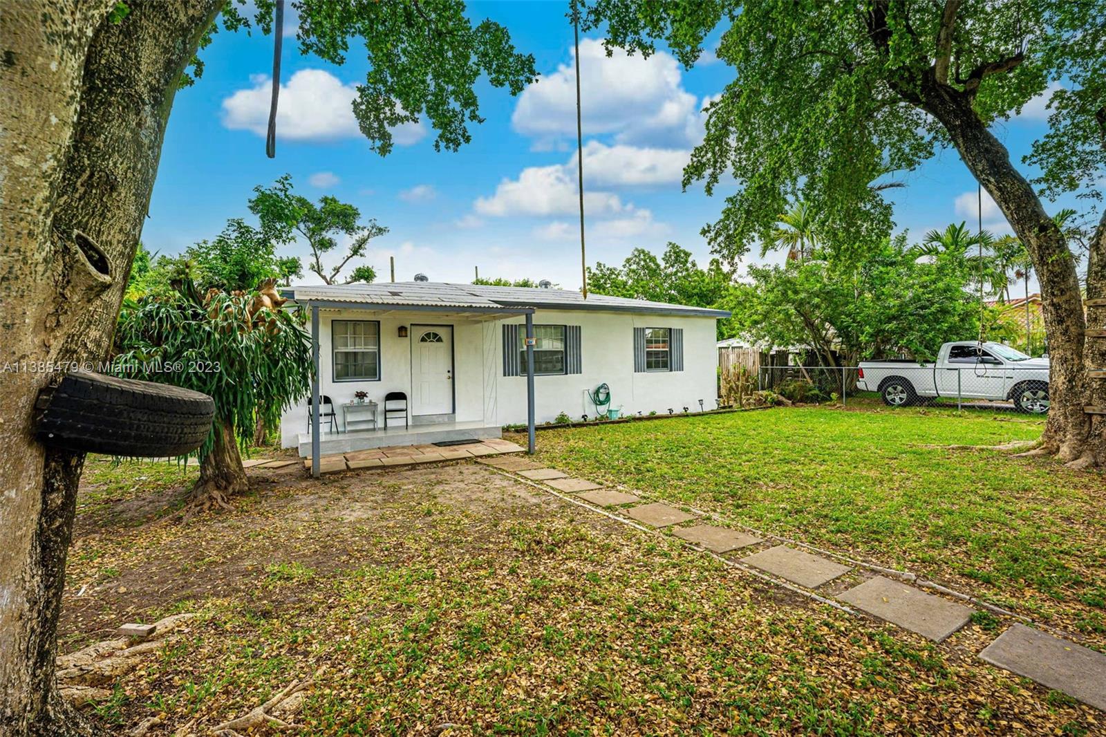 8241 Southwest 37th Street Miami, FL 33155 - Photo 6 of 46 a view of a house with a yard and sitting area