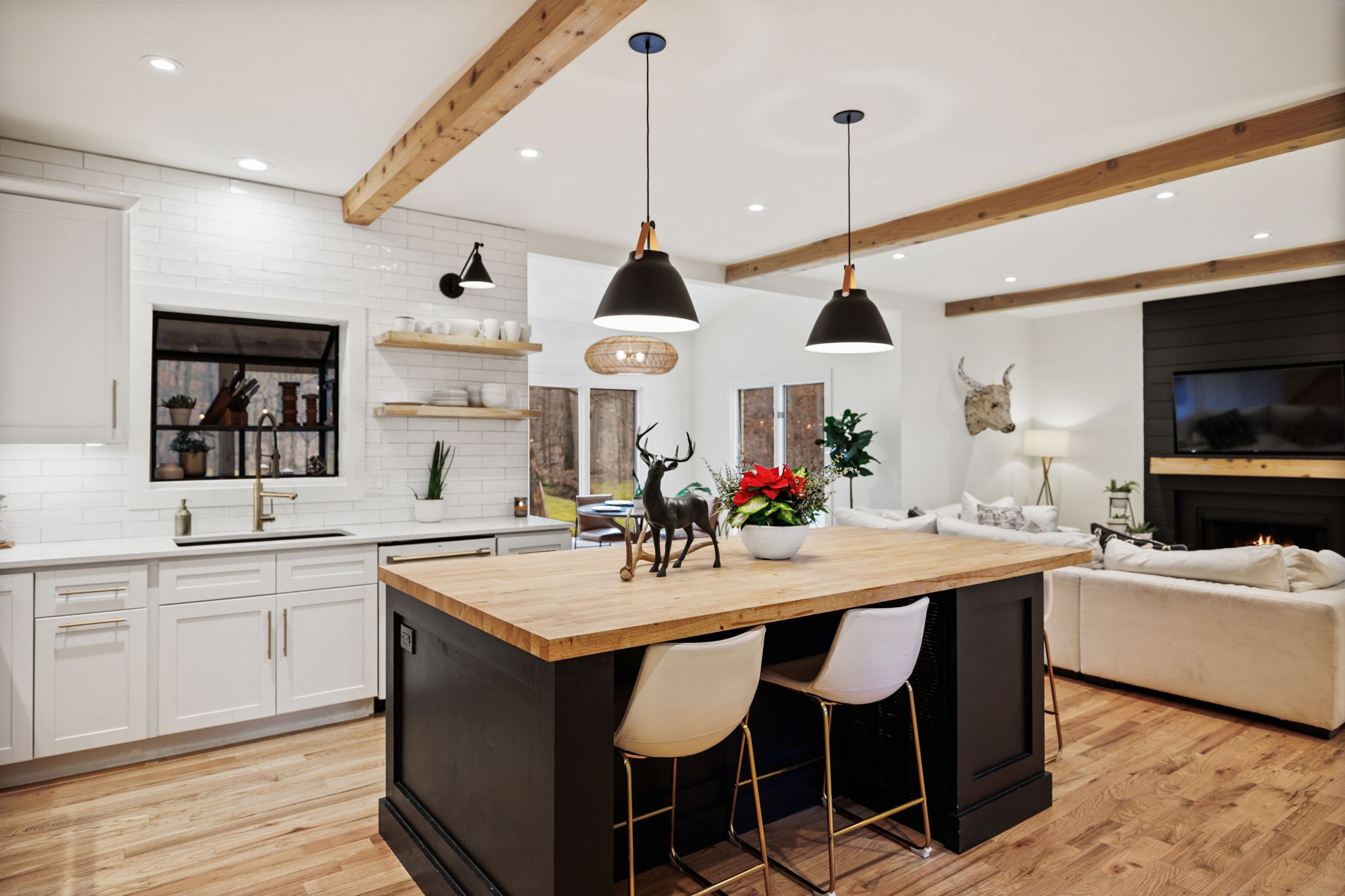 3945 New Highway 96 West Franklin, TN 37064 - Photo 13 of 69 a kitchen with stainless steel appliances granite countertop a sink a stove a dining table and chairs