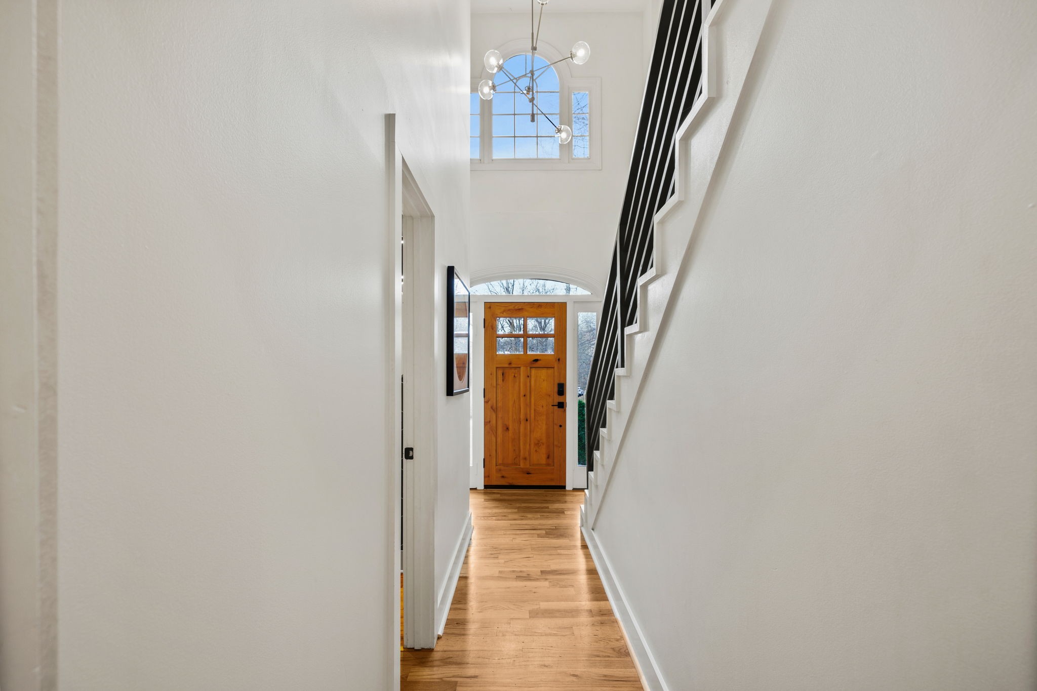 3945 New Highway 96 West Franklin, TN 37064 - Photo 32 of 69 a view of a hallway with wooden floor and staircase