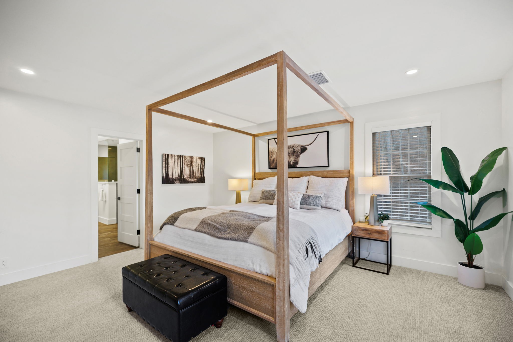 3945 New Highway 96 West Franklin, TN 37064 - Photo 47 of 69 a spacious bedroom with a bed and a potted plant