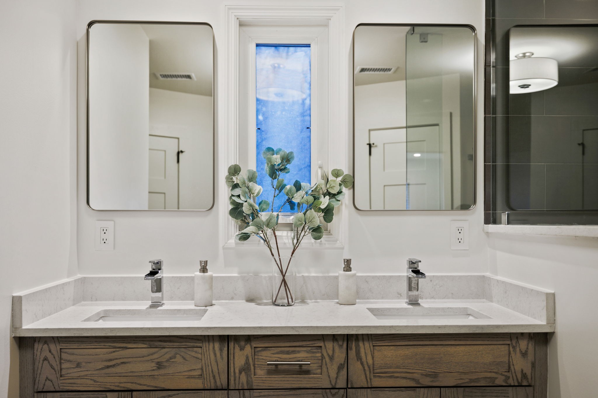 3945 New Highway 96 West Franklin, TN 37064 - Photo 52 of 69 a bathroom with double vanity sinks a vanity and a mirror