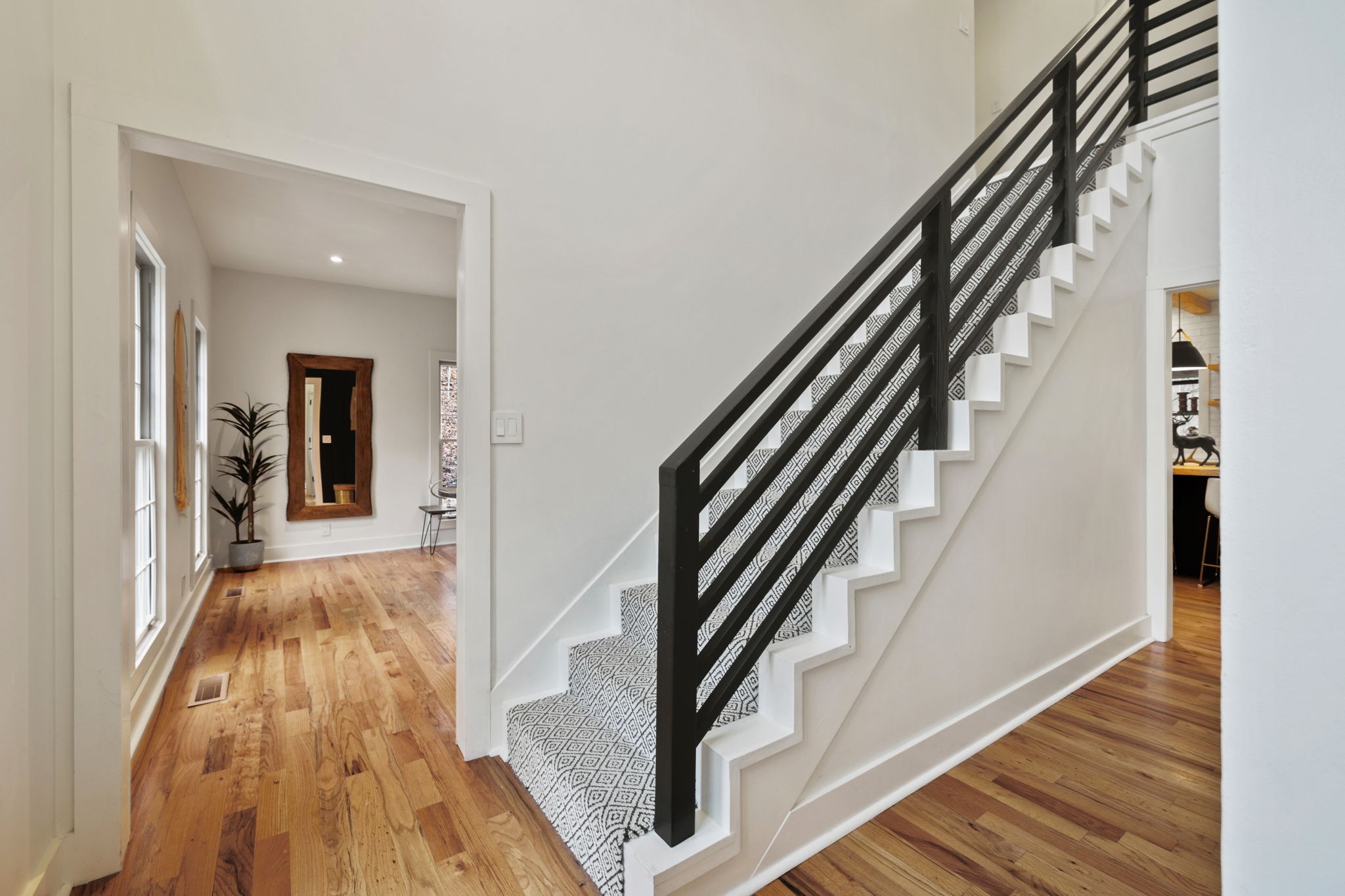 3945 New Highway 96 West Franklin, TN 37064 - Photo 6 of 69 a view of a hallway with wooden floor and staircase