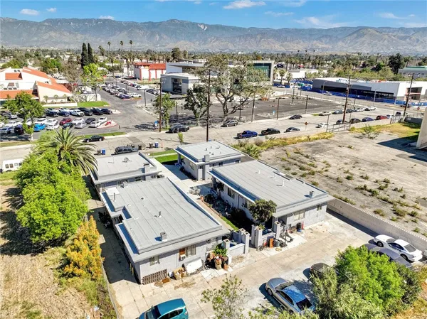 an aerial view of a house with outdoor space