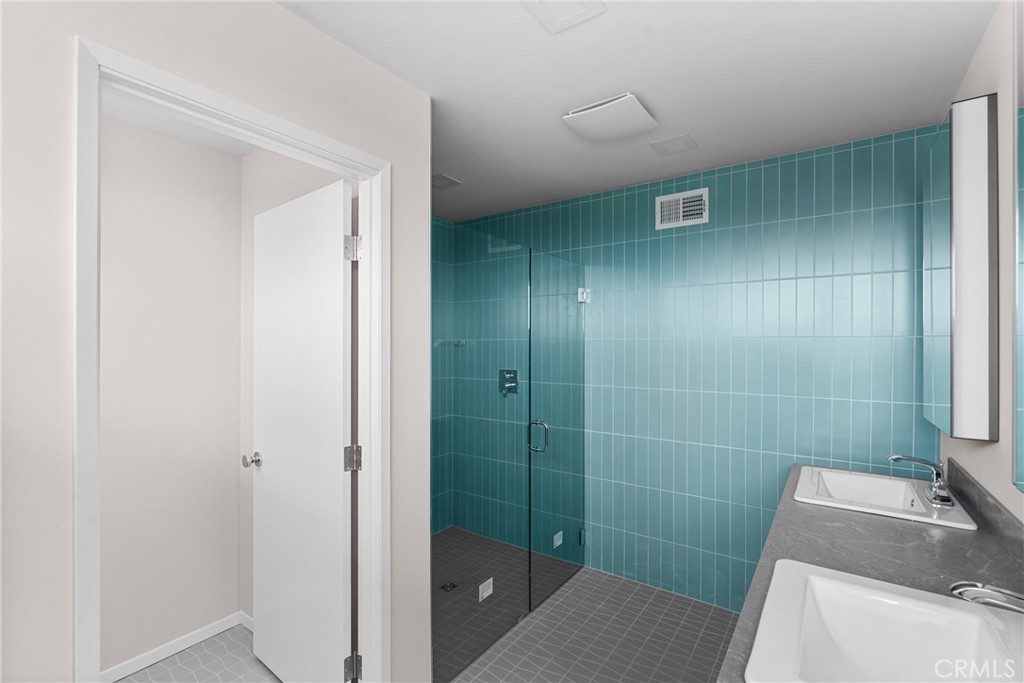 2 Cambridge Drive Lompoc, CA 93436 - Photo 12 of 27 a bathroom with a sink and shower