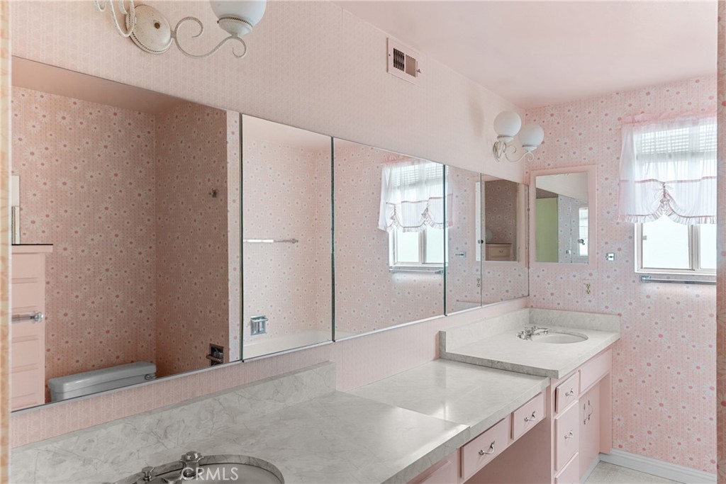 2 Cambridge Drive Lompoc, CA 93436 - Photo 16 of 27 a bathroom with a sink vanity granite tub and a mirror