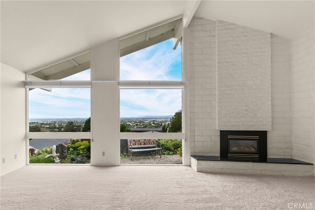 2 Cambridge Drive Lompoc, CA 93436 - Photo 7 of 27 a view of a floor to ceiling window and a fireplace