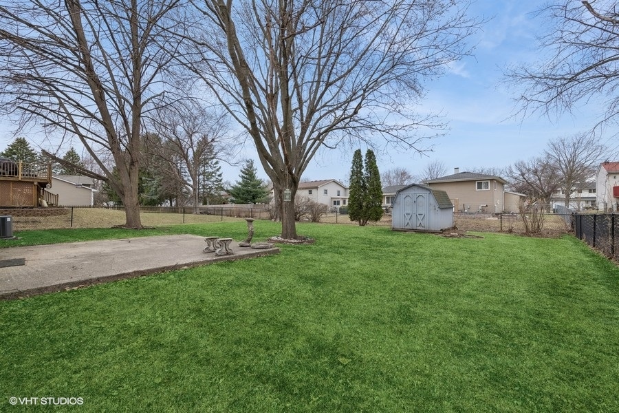 544 Arthur Drive Cary, IL 60013 - Photo 20 of 23 a view of a backyard with large trees