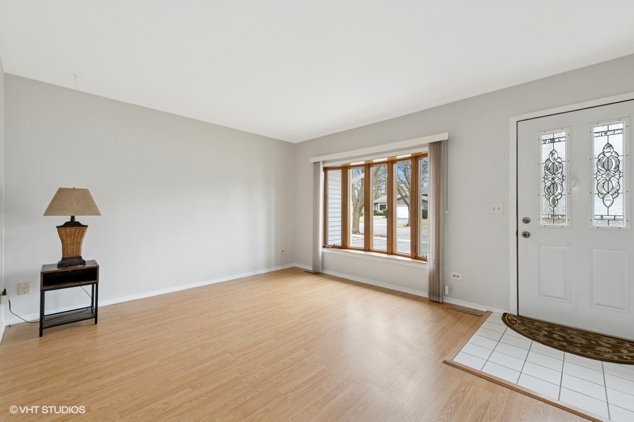 544 Arthur Drive Cary, IL 60013 - Photo 3 of 23 a view of an empty room and glass door