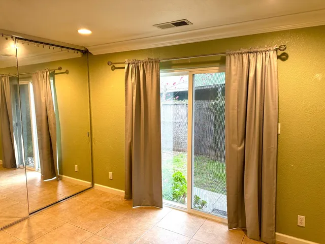 a view of a bathroom with a shower and a tub