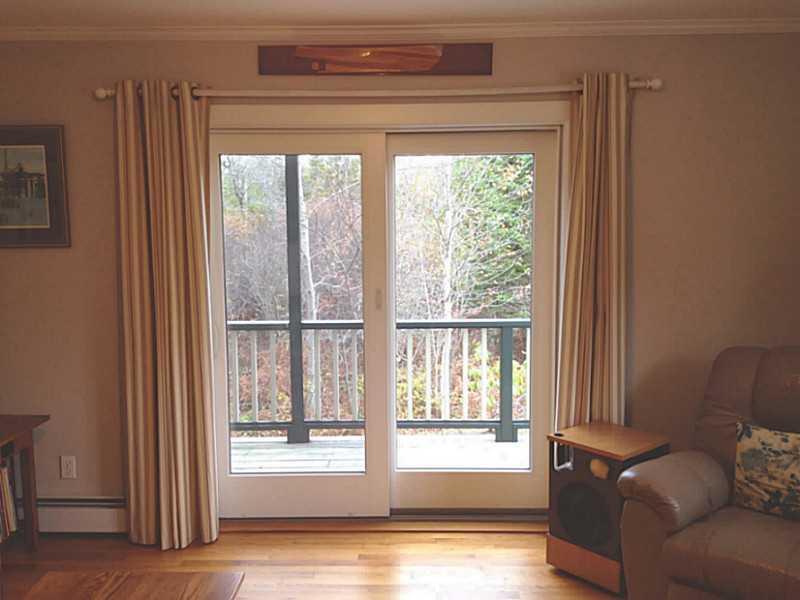 341 Tremont Road Tremont, ME 04612 - Photo 11 of 16 Living Room. Living room sliders.