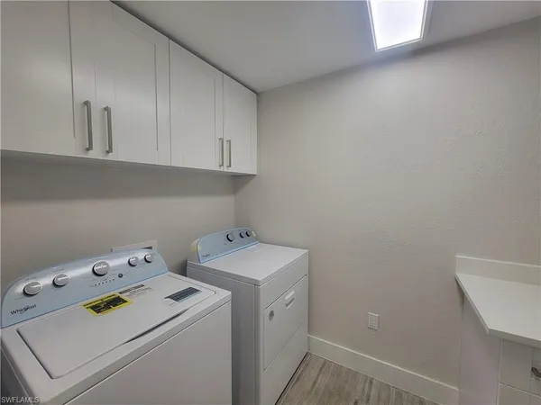 a view of storage and utility room with washer and dryer