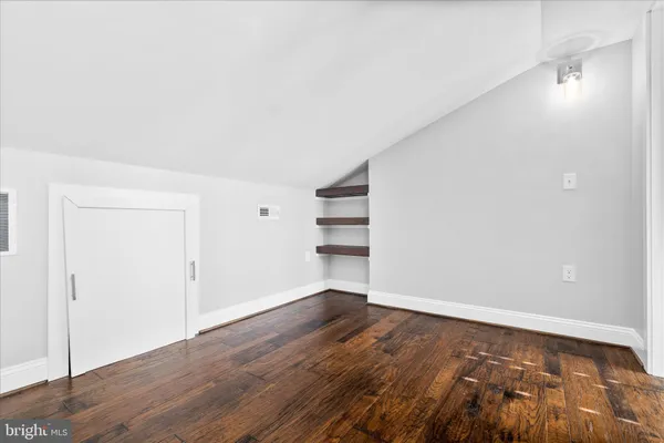 a workspace with furniture and wooden floor