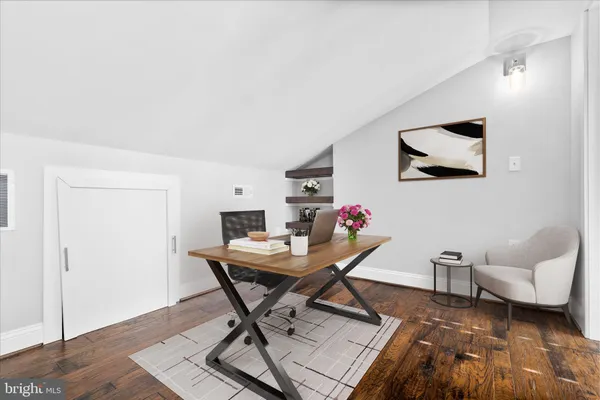 an empty room with wooden floor