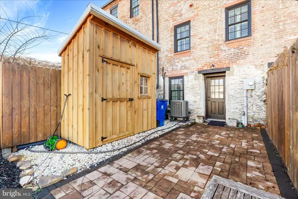 a view of a cars park in front of a building