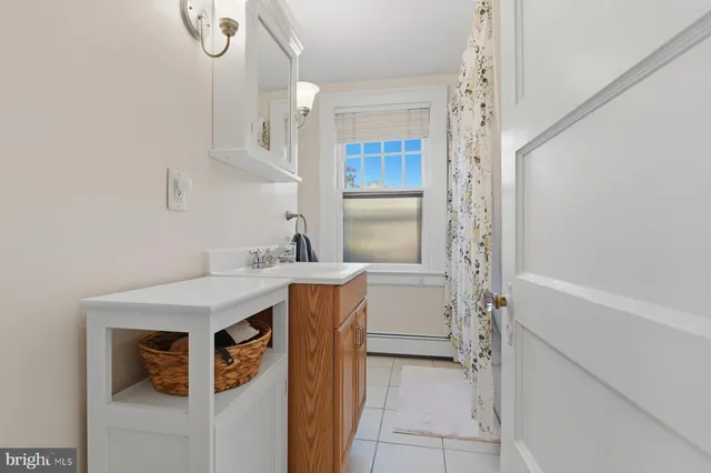 a utility room with cabinets washer and dryer