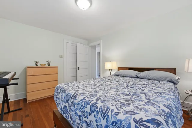 a bedroom with a bed and a closet