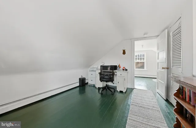 a workspace with furniture and a book shelf